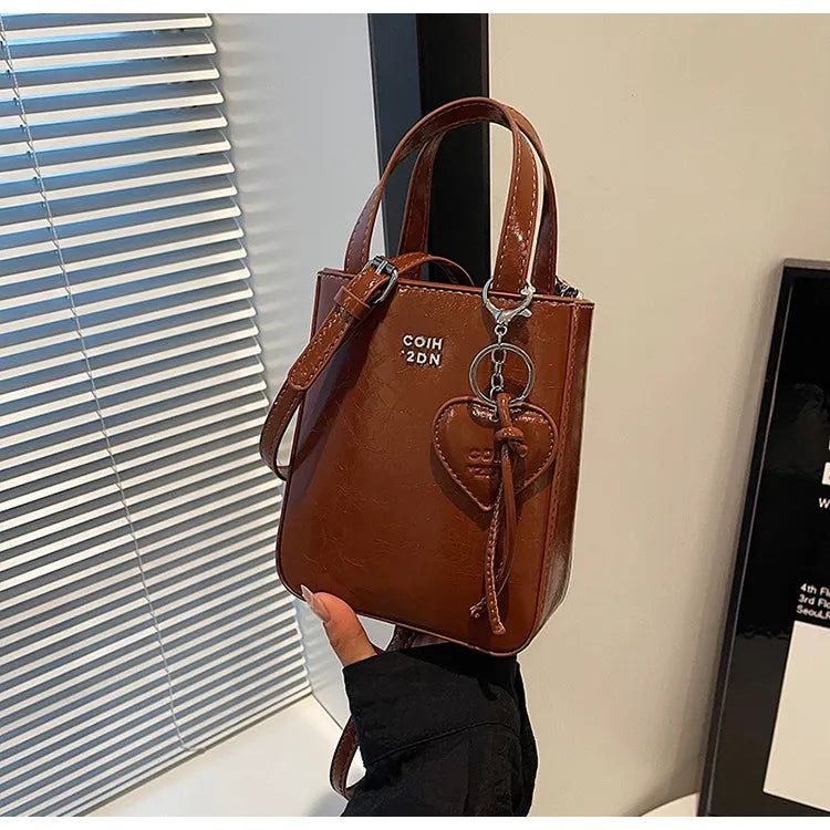 Women Fashion Casual Solid Color Love Pendant Bucket Shoulder Bag