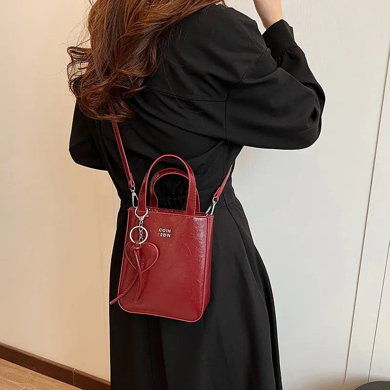 Women Fashion Casual Solid Color Love Pendant Bucket Shoulder Bag